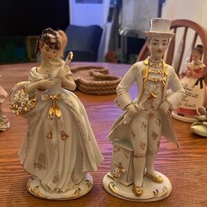 Elegant Porcelain Figurines with Gold Accents